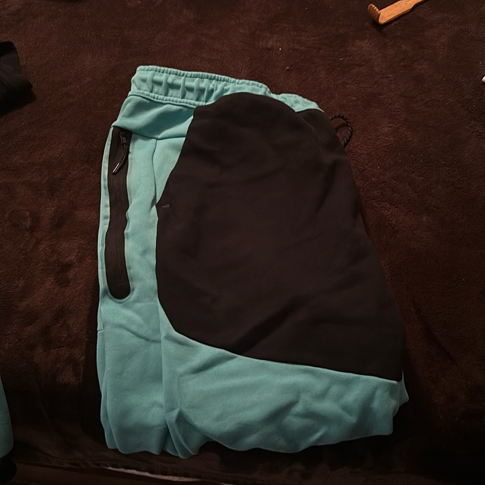 Nike tech turquoise and black sweat pants